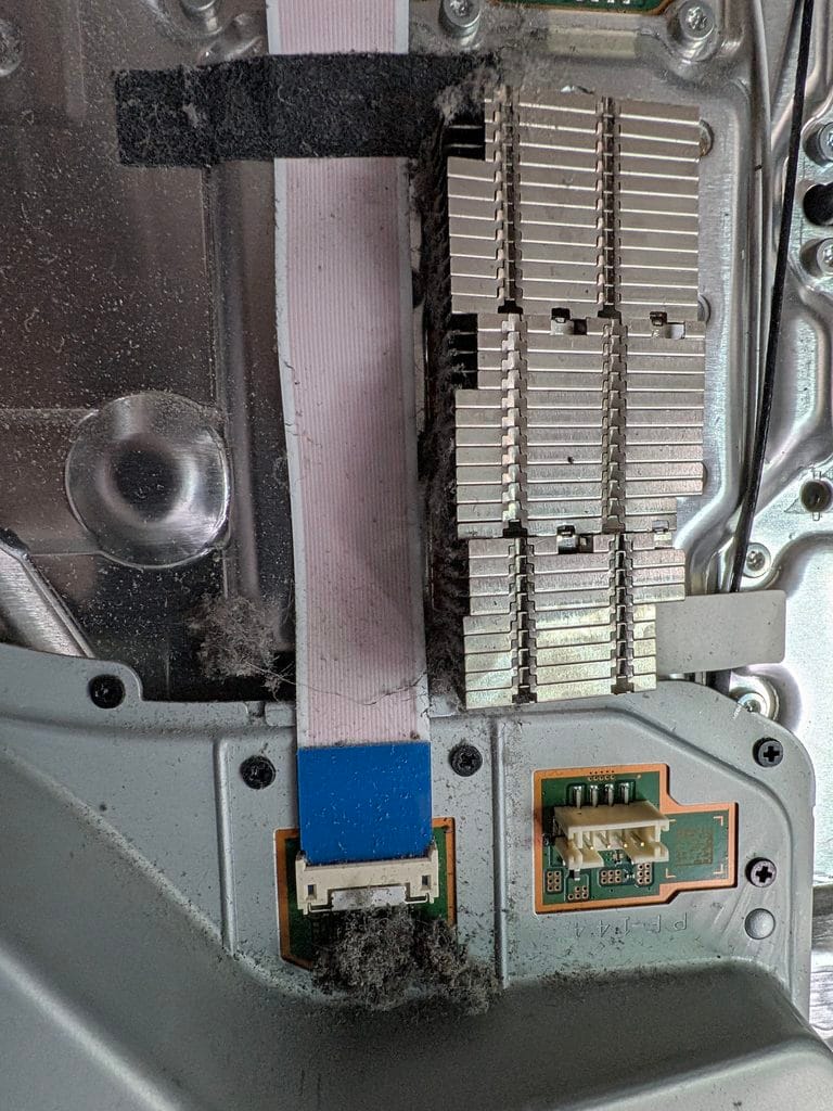 PS5 Shutting down in Market Weighton | Saved Game Service Plan 2 PS5 disc drive showing build up of dust and fluff